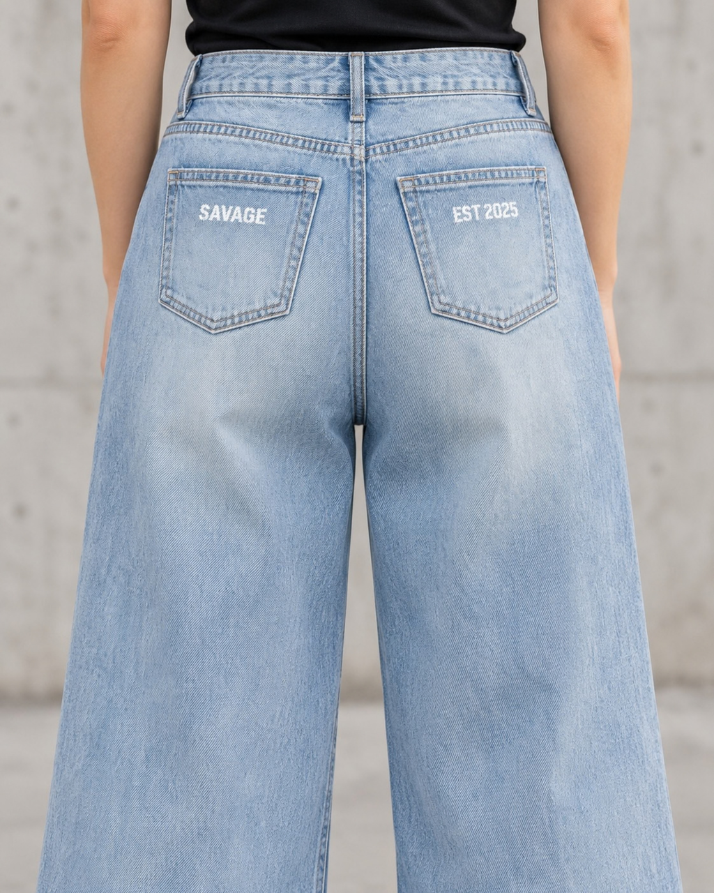 Savage Distressed Wide Leg Jeans in Vintage Blue.